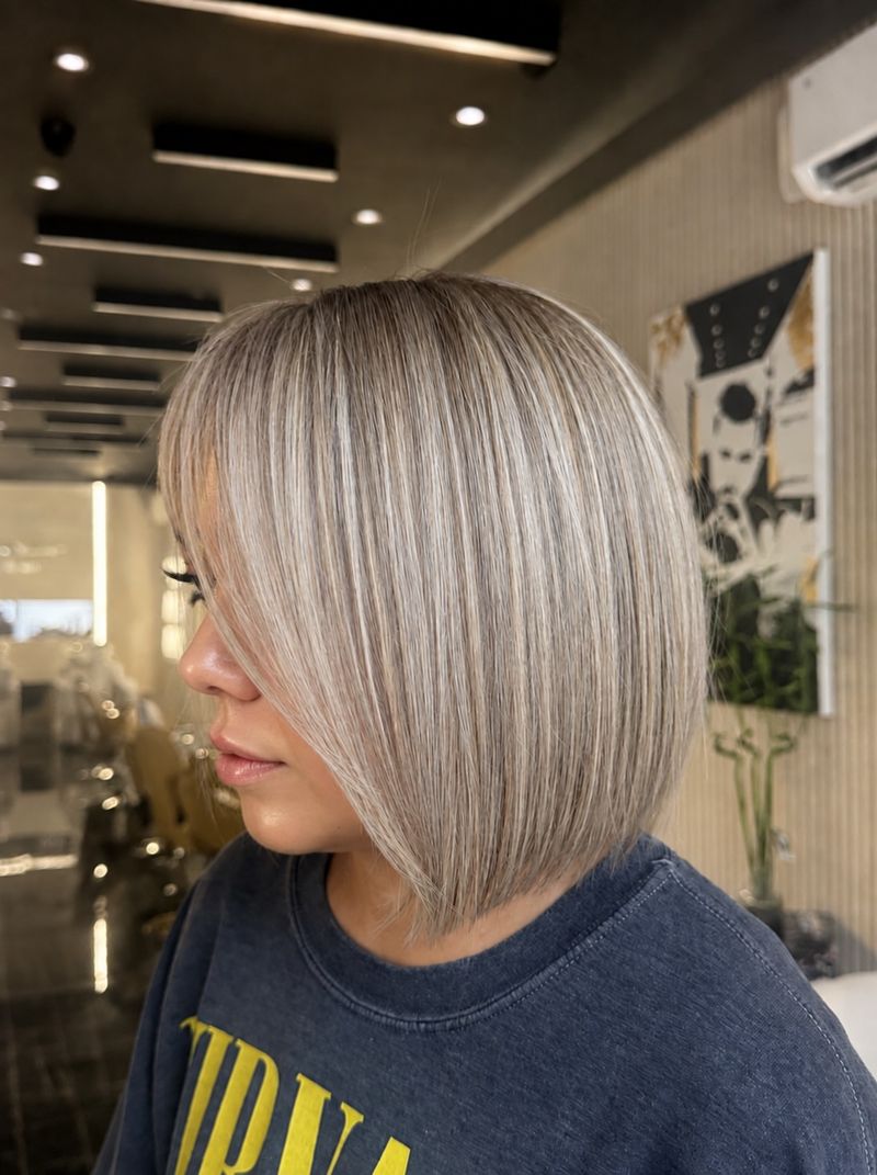 12. Silvery Sleek Angled Bob