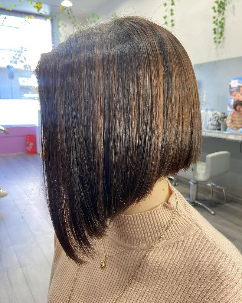 34. Sleek Angled Bob with Caramel Highlights