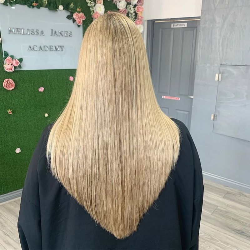 13. Sleek Blonde V-Cut with Sharp Point