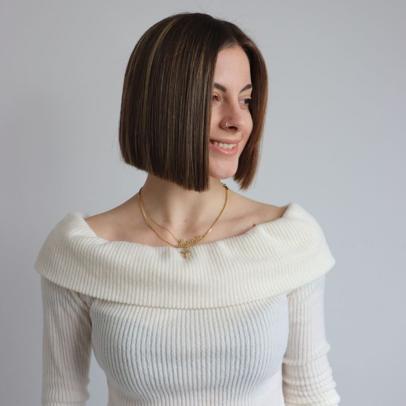70. Sleek Blunt Cut with Caramel Highlights