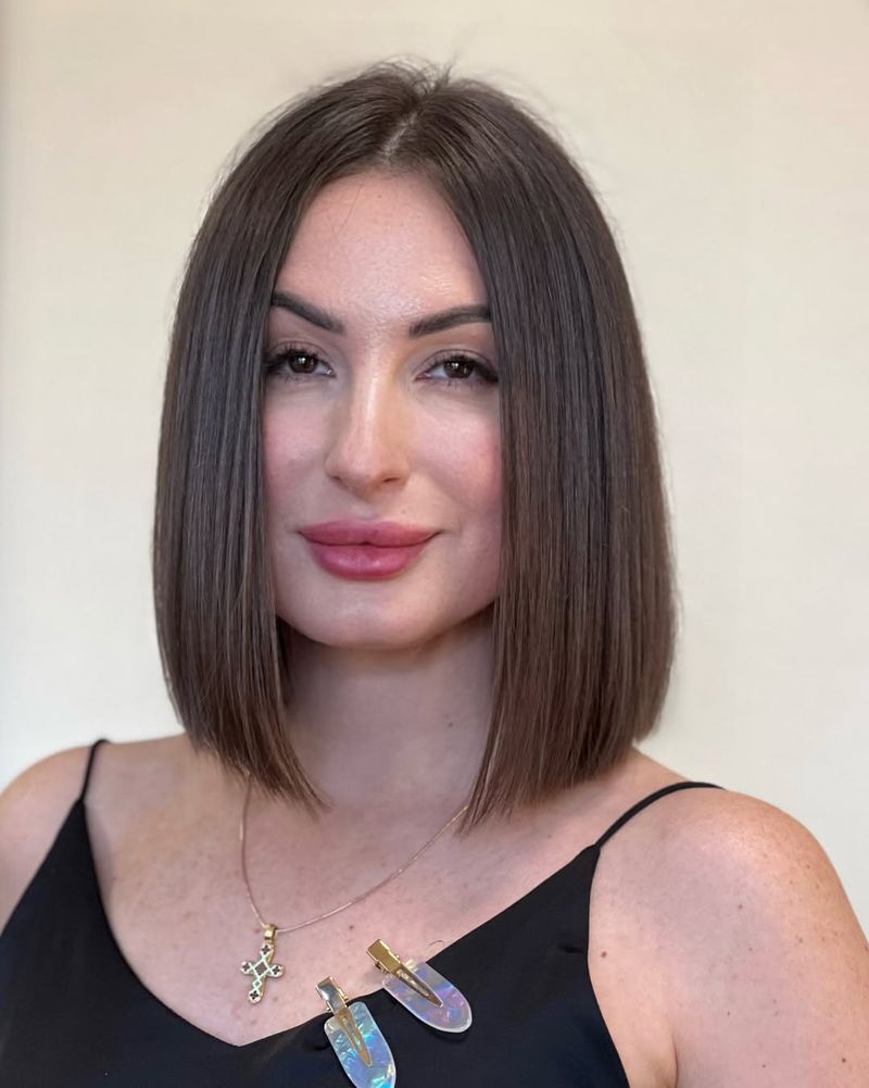 41. Sleek Center-Parted Brown Bob