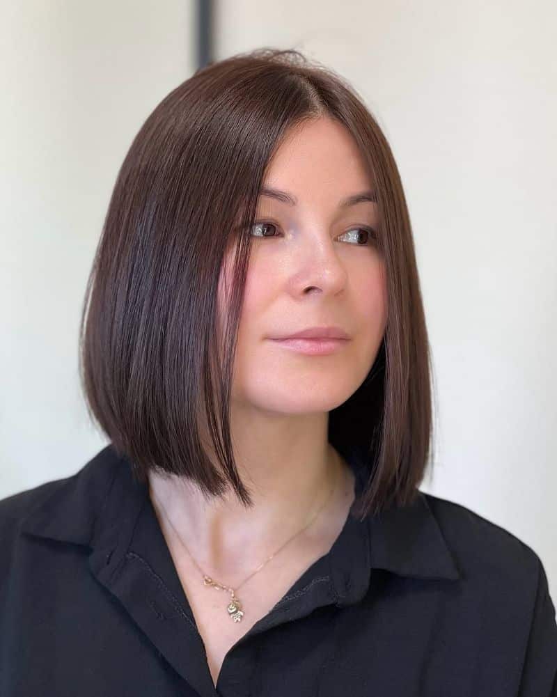 50. Sleek Center-Parted Chestnut Bob