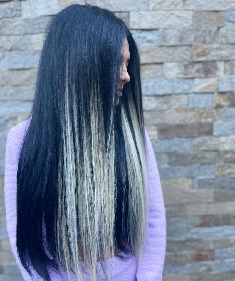 36. Sleek Dark Hair with Platinum Face-Framing Streaks