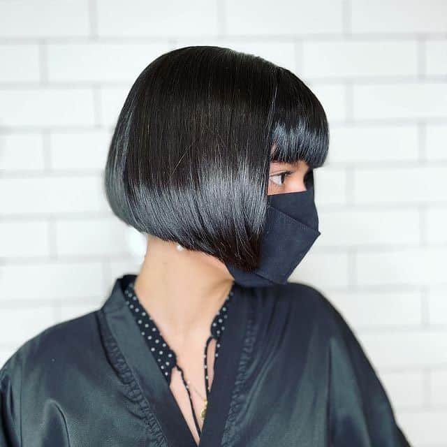 18. Sleek Inverted Bob with Heavy Fringe