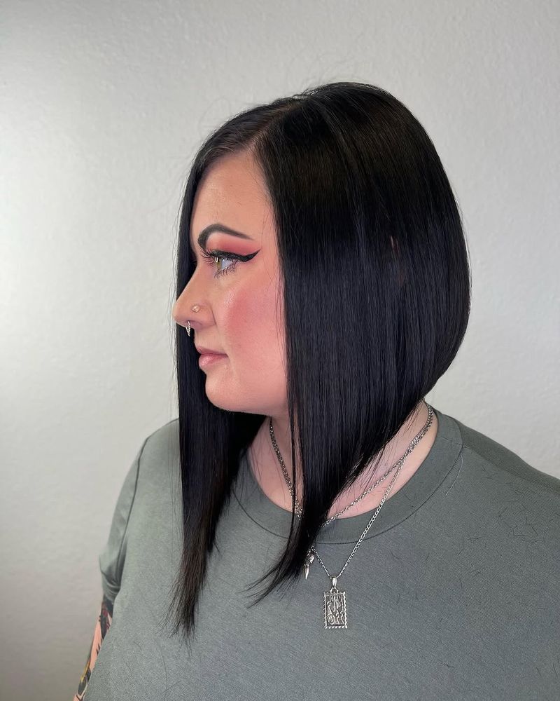 14. Sleek Jet Black Angled Bob