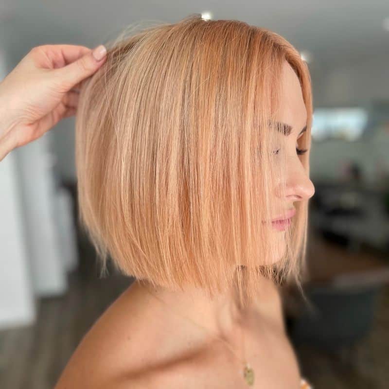 11. Sleek Pastel Peach Bob