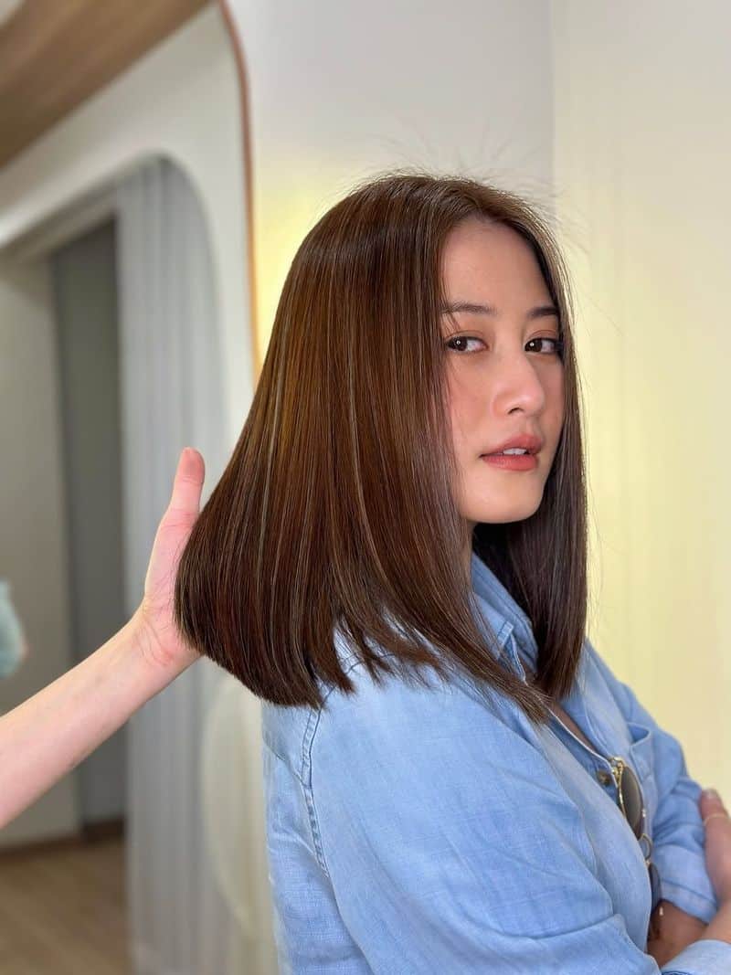 22. Sleek Shoulder-Length Ash Brown Lob
