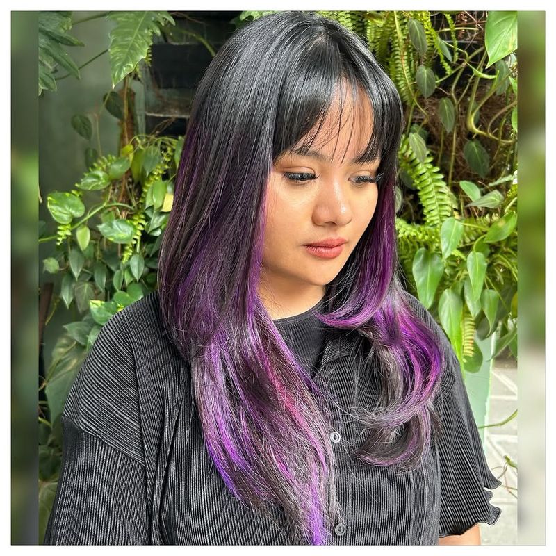 52. Smoky Black Hair with Electric Purple Peekaboo Highlights