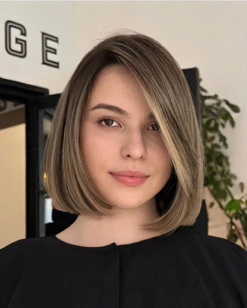 59. Smooth Rounded Bob with Ash Highlights