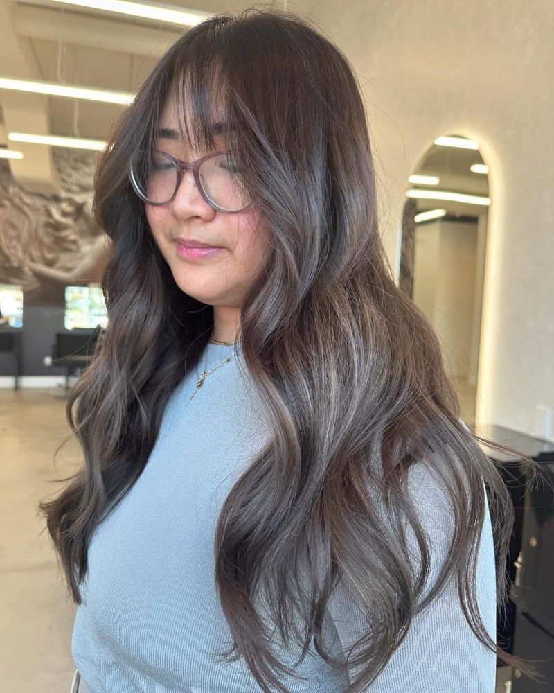 17. Soft Ash Tones with Wispy Fringe