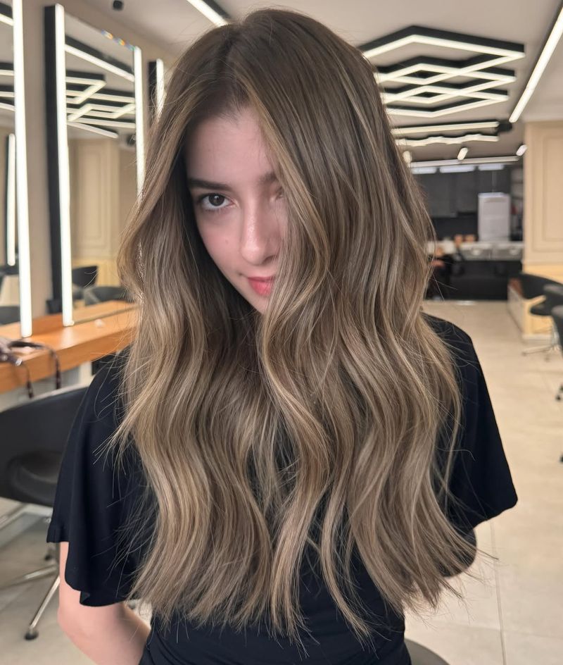 20. Soft Ash Waves with Bright Face-Framing Highlights