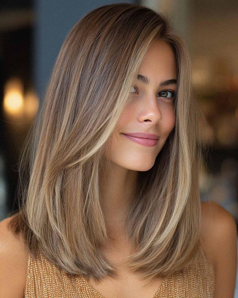 3. Soft Caramel Lob with Long Side-Swept Layers