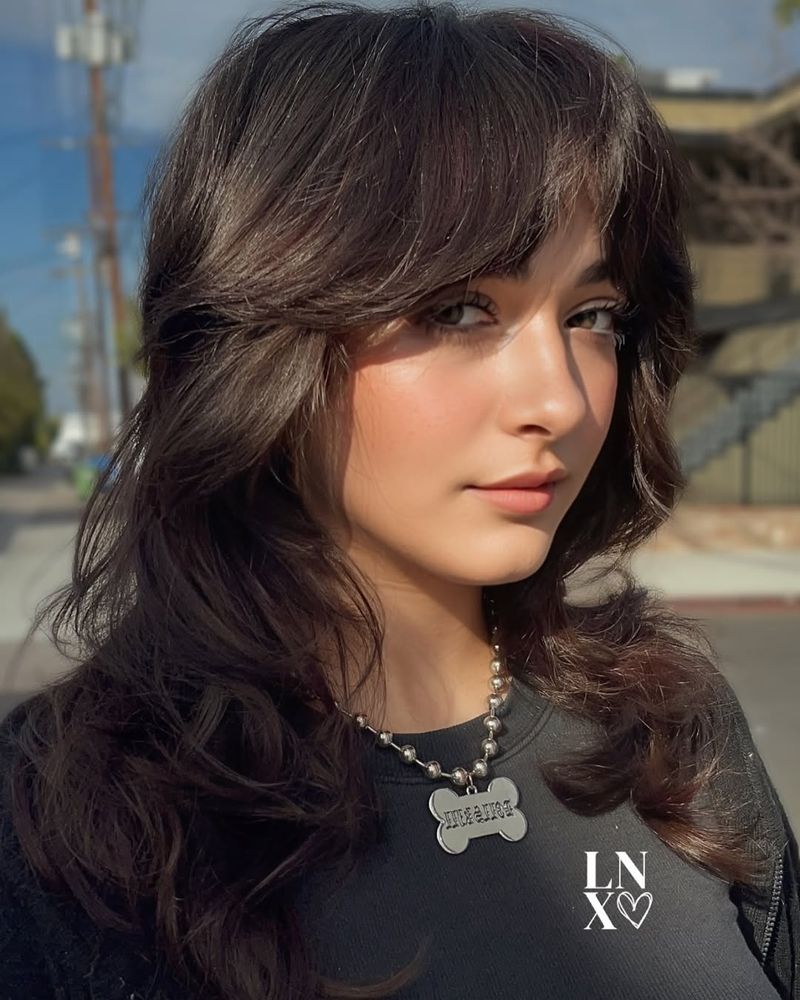 2. Soft Chestnut Shag with Curled Bangs