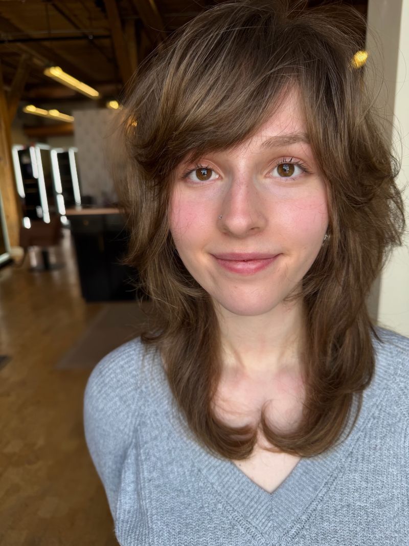 11. Soft Chestnut Shag with Side-Swept Bangs
