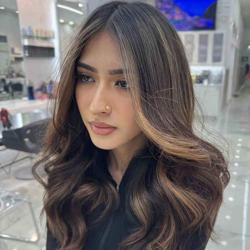 14. Soft Chestnut Waves With Butter Blonde Highlights