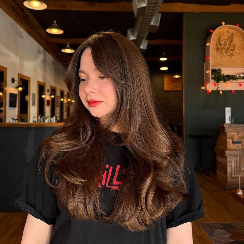 27. Soft Curtain Bangs with Long Warm Brown Layers