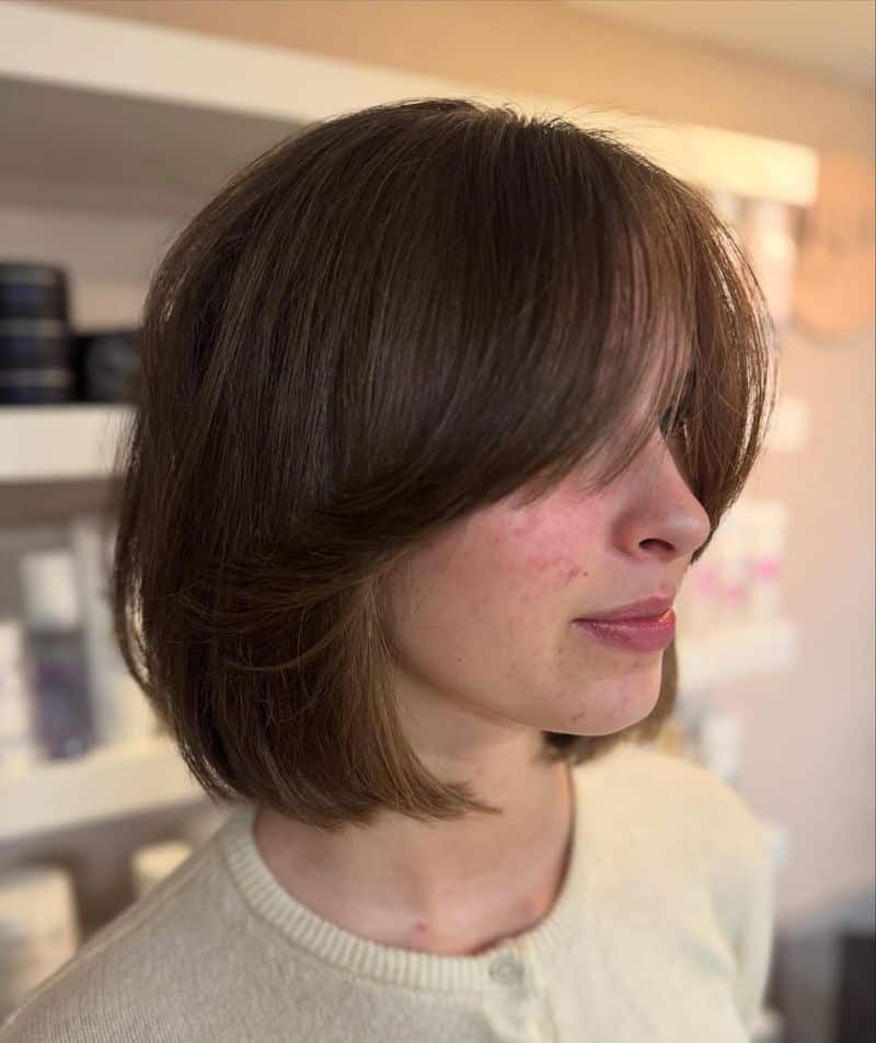 6. Soft Feathered Bob with Bangs