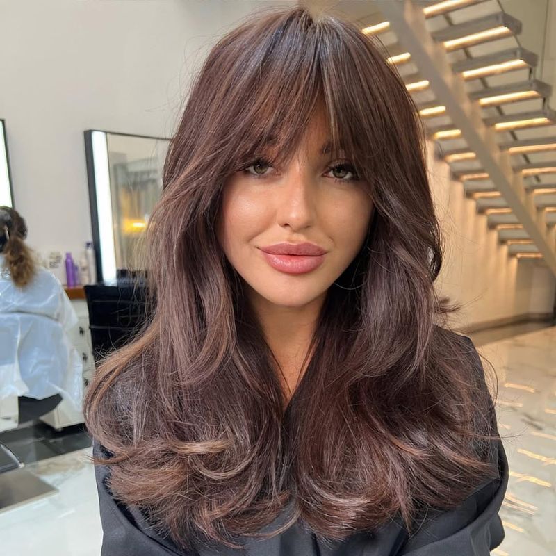 16. Soft Hazelnut Layers with Curtain Bangs