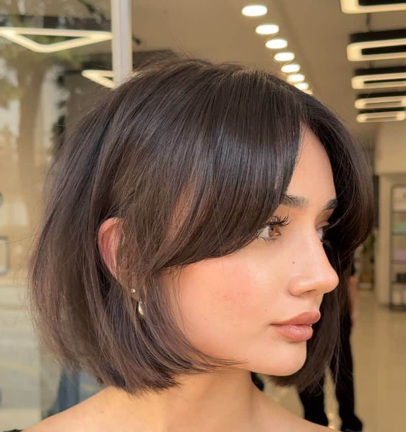 15. Soft Layered Bob with Curtain Bangs