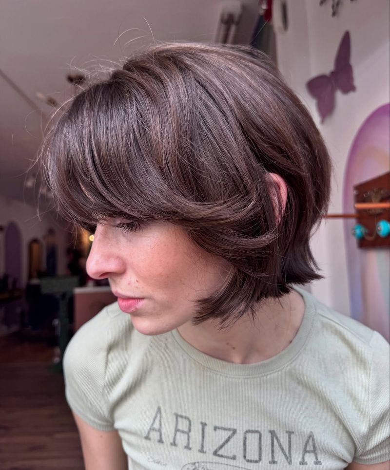 2. Soft Layered Bob with Sweeping Bangs