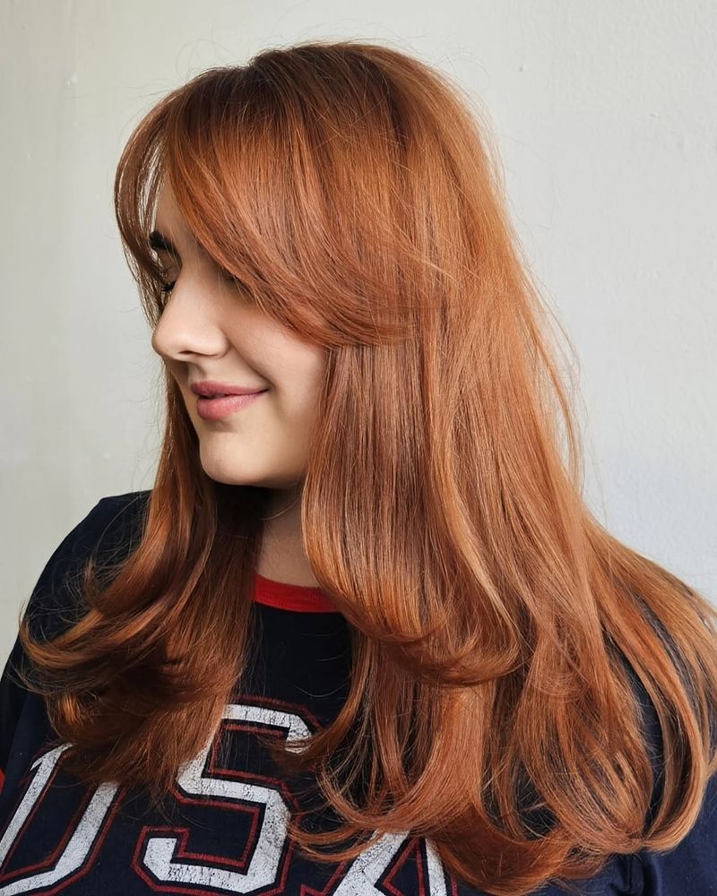 22. Soft Side-Swept Bangs with Layered Red Copper
