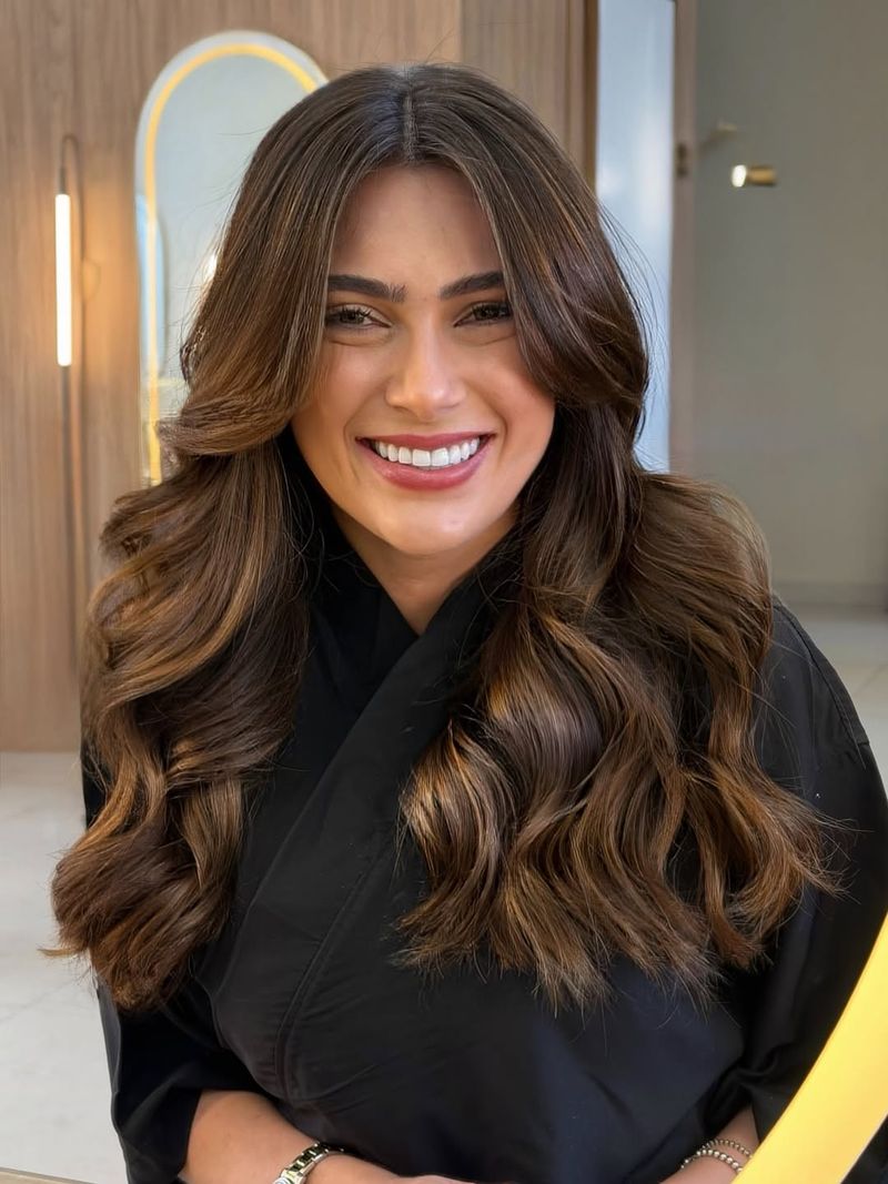 19. Soft Toffee Waves with Curtain Bangs