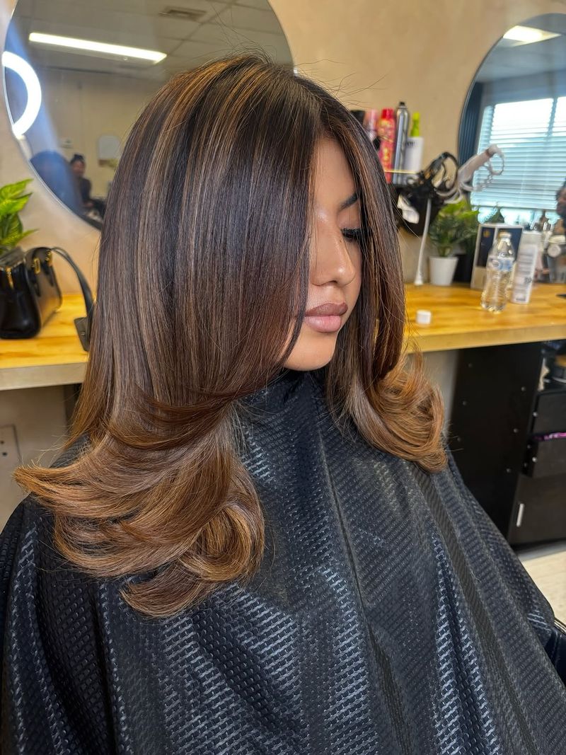 45. Softly Layered Caramel Highlights