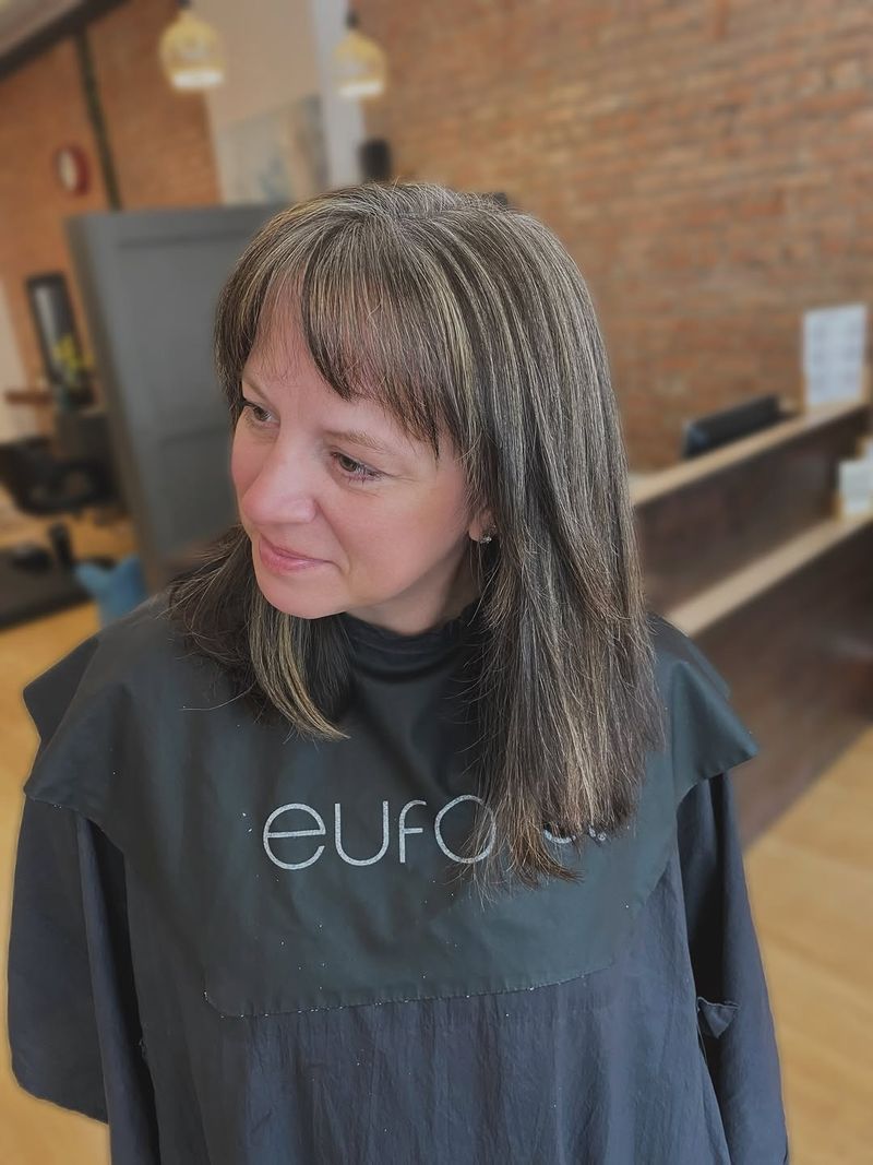 14. Softly Touched Bangs and Medium Layers