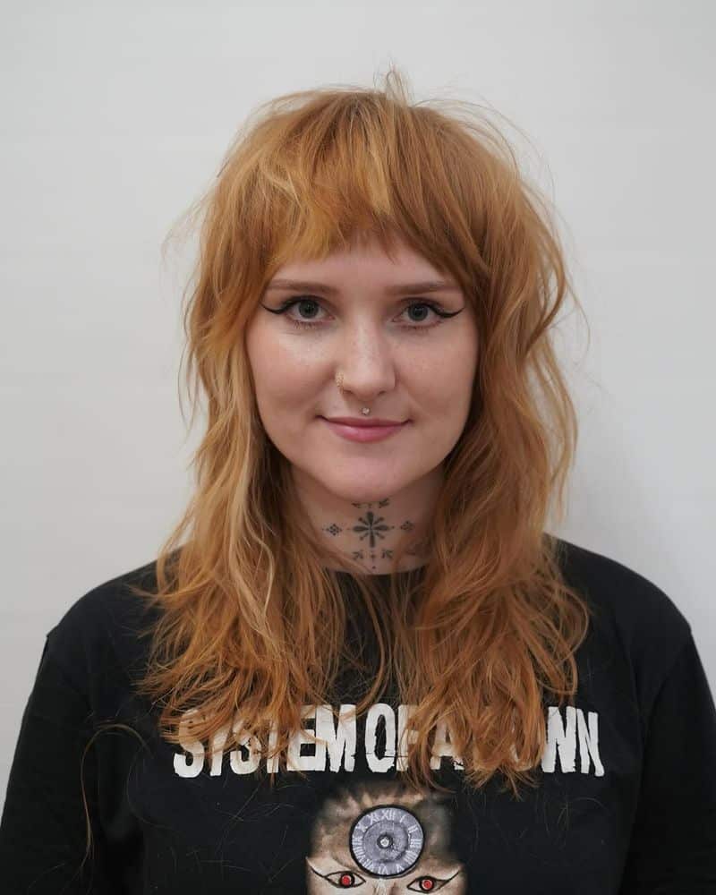 47. Strawberry Blonde Shag with Baby Bangs