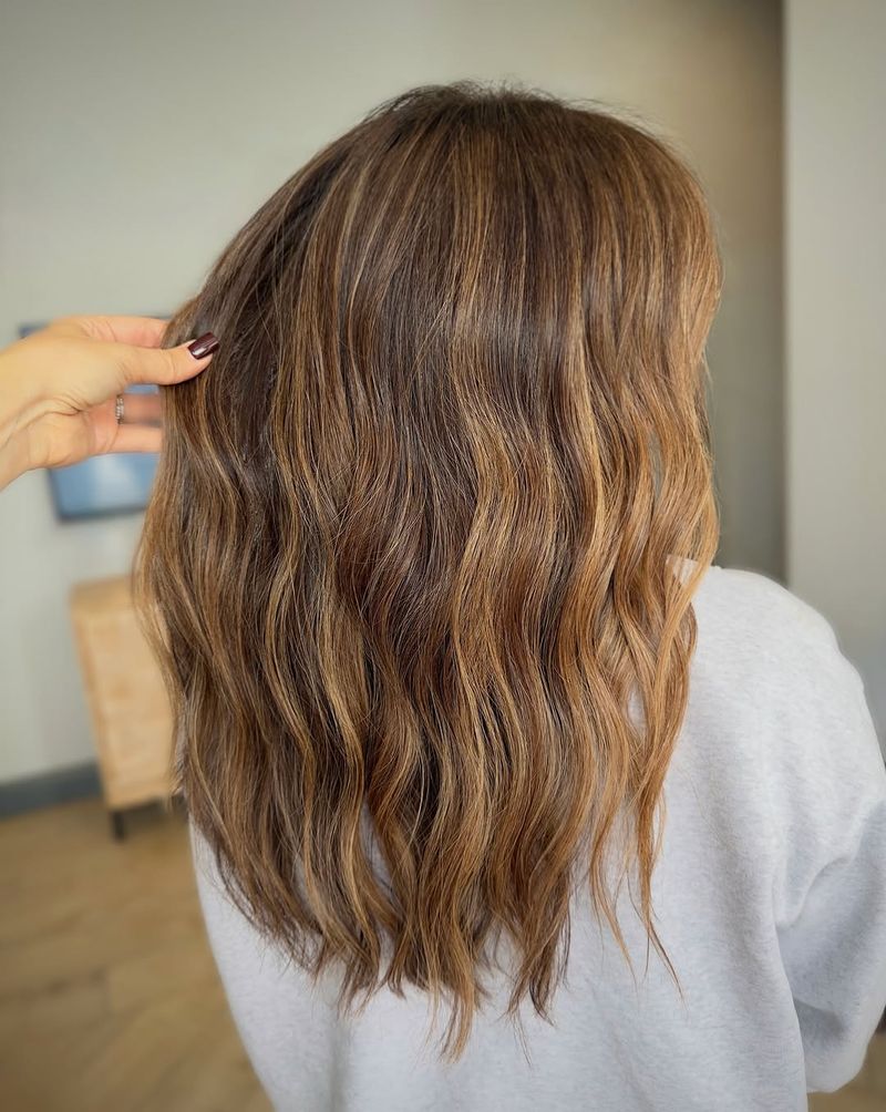 21. Subtle Amber Highlights on Medium Brown Hair