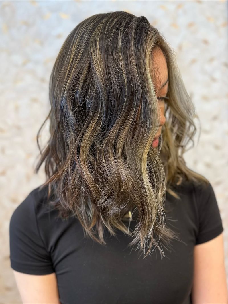 11. Sun-Kissed Ash Highlights with Soft Waves
