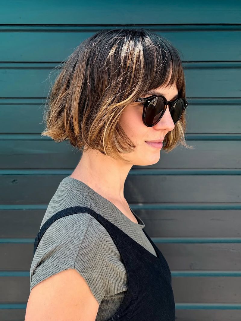 3. Sun-Kissed Highlights with Micro Bangs