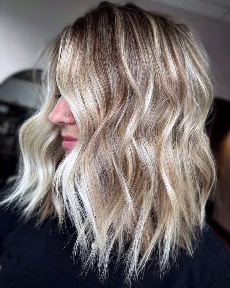 20. Sun-Kissed Tousled Lob with Bright Blonde Highlights