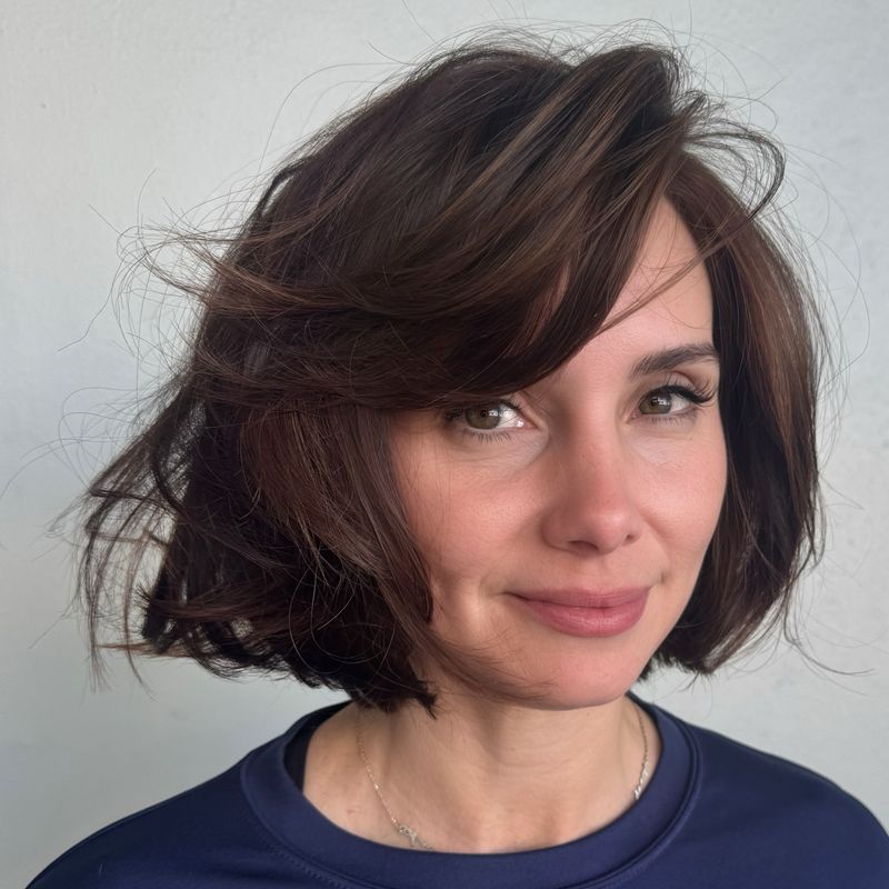 60. Swept-Back Chestnut Bob with Deep Side Part