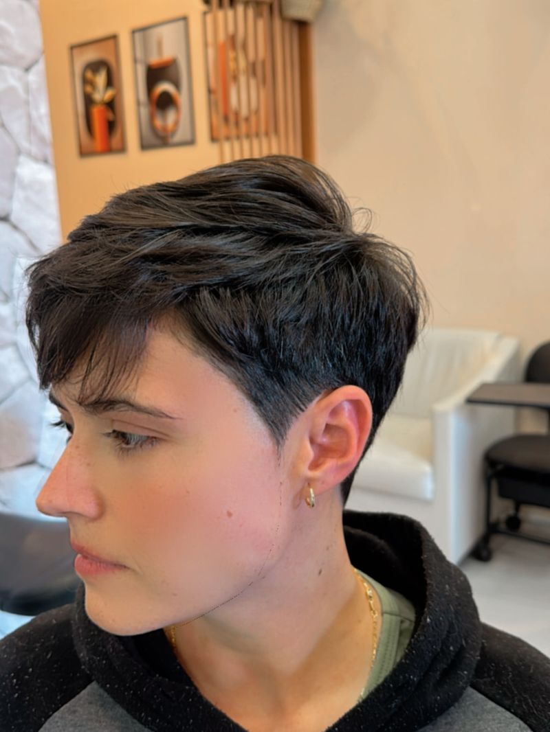 40. Tapered Dark Pixie with Soft Side-Swept Bangs
