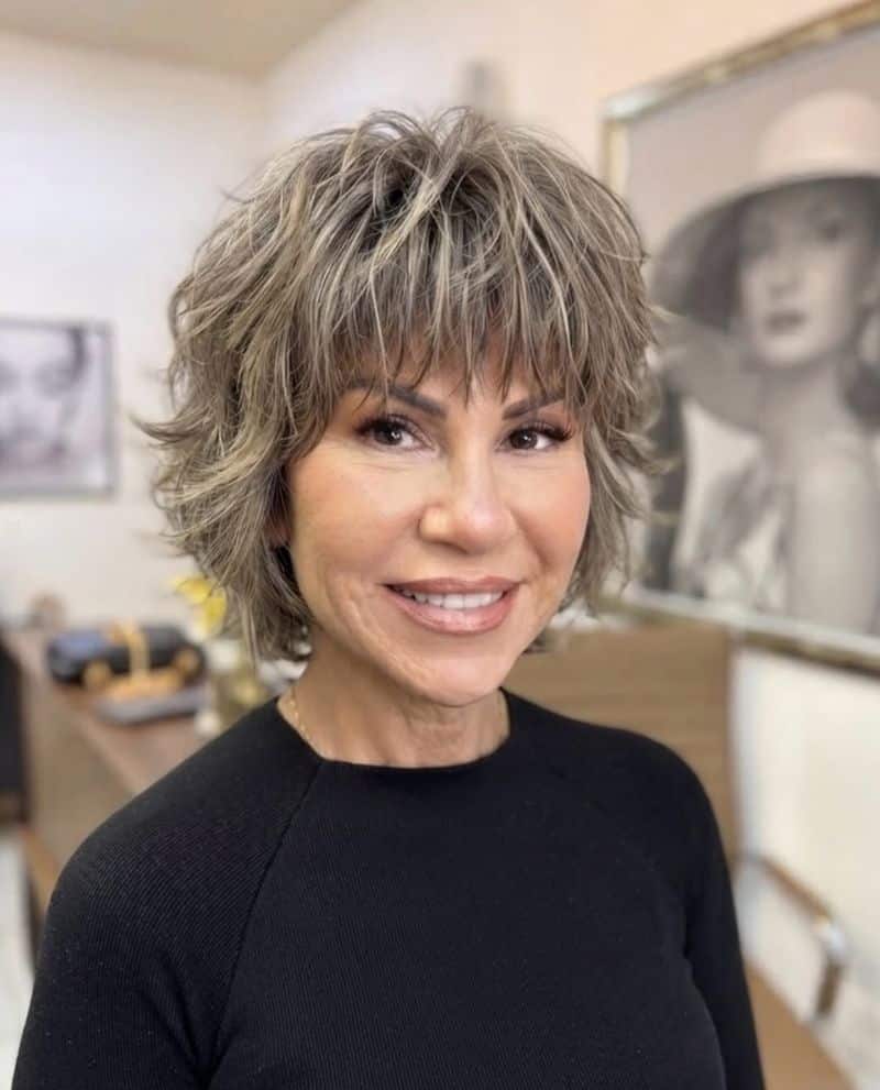 44. Textured Ash Blonde Shag With Wispy Bangs