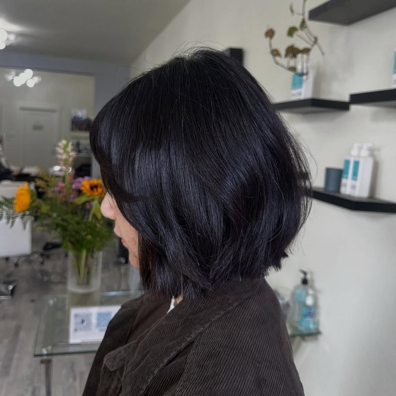 6. Textured Dark Espresso Bob with Soft Fringe