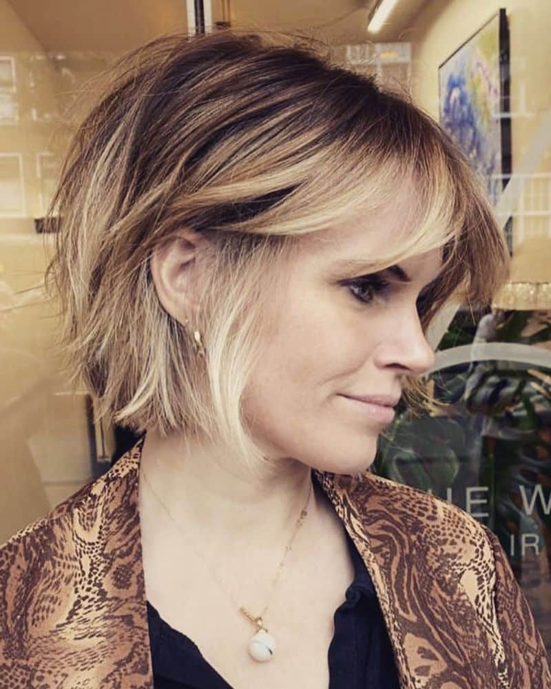 32. Tousled Blonde Bob with Undercut Dimension
