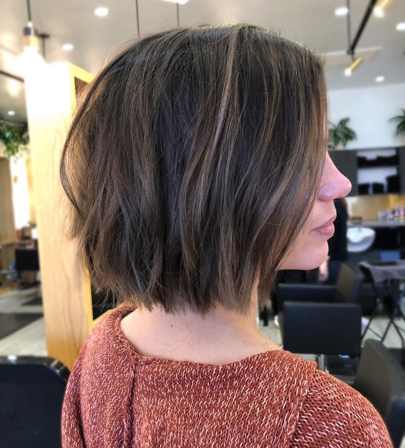 25. Tousled Brunette Bob with Soft Layers