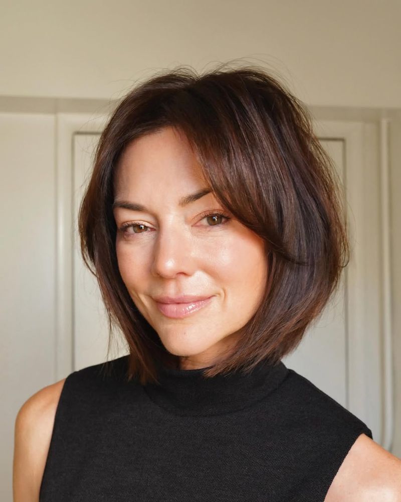 53. Tousled Chestnut Bob with Soft Curtain Bangs