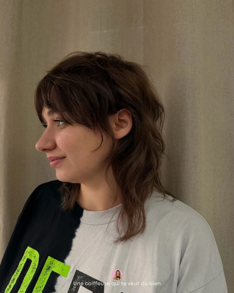 34. Tousled Chestnut Shag With Wispy Bangs