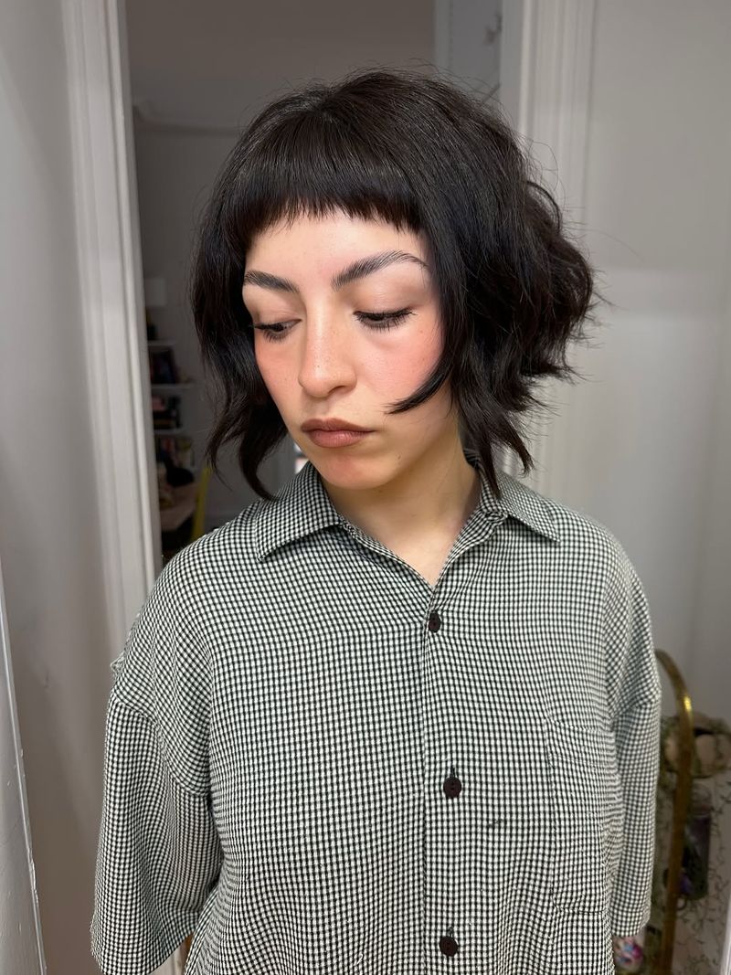 40. Tousled Dark Bob with Piecey Micro Bangs
