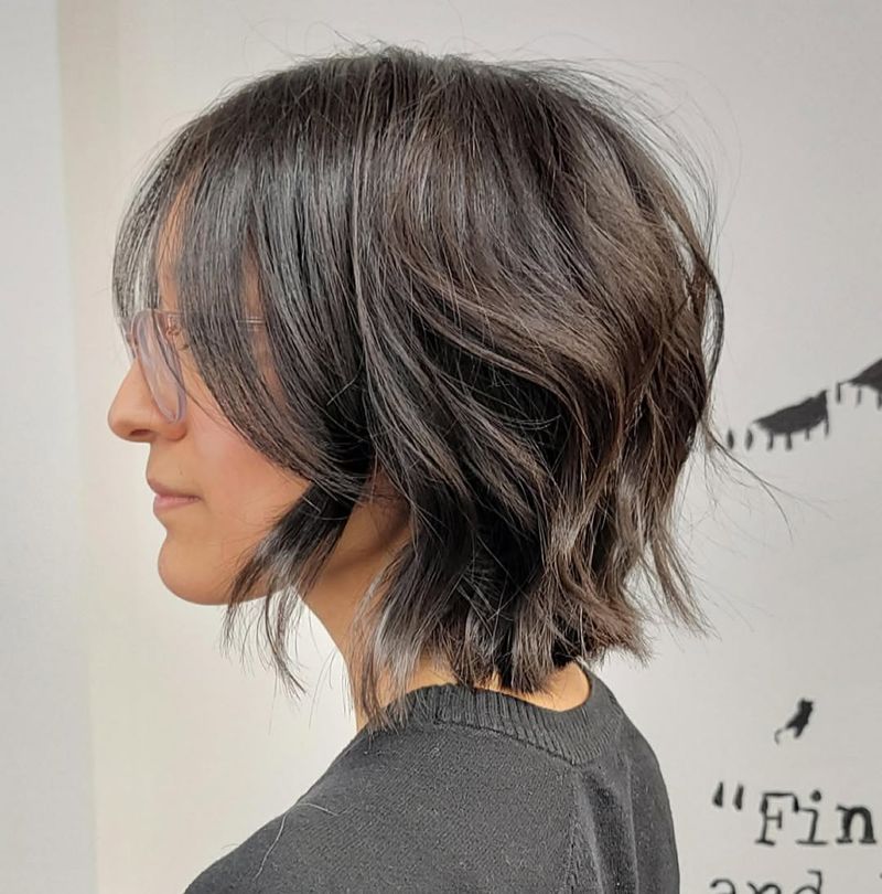 27. Tousled Dark Bob with Soft Curtain Bangs