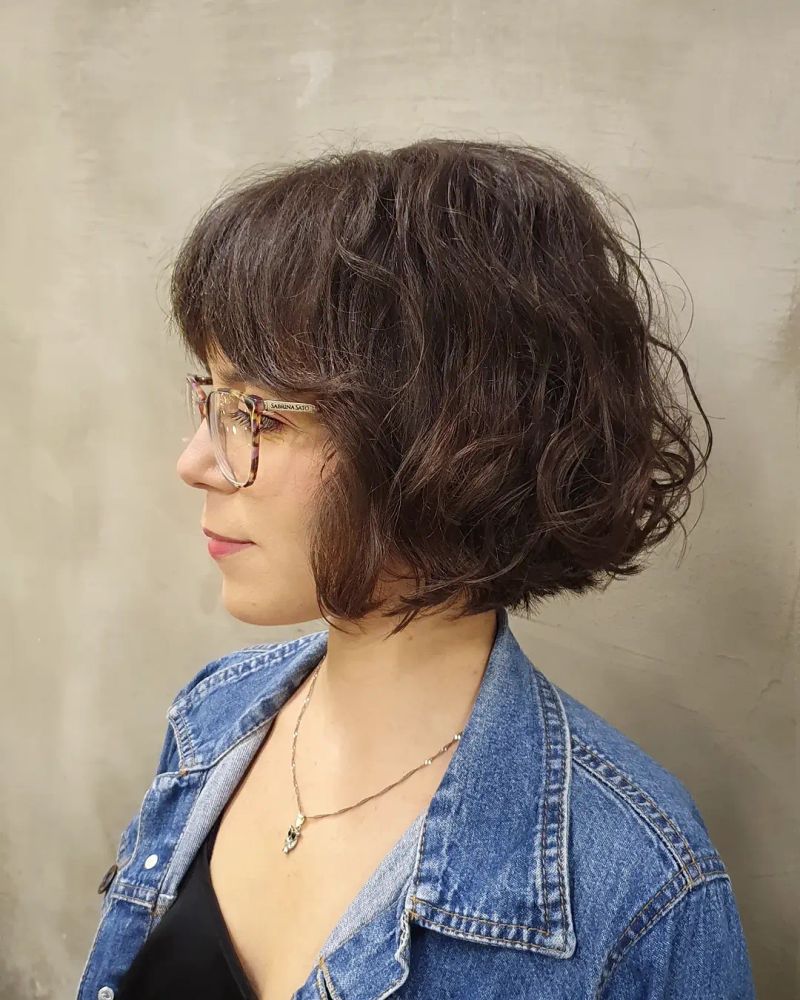 19. Tousled Dark Brown Bob with Full Bangs