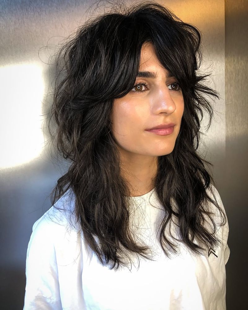 7. Tousled Dark Shag with Curtain Bangs