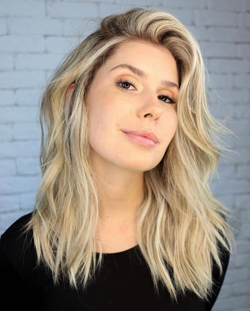 29. Tousled Platinum Shag with Deep Side Part