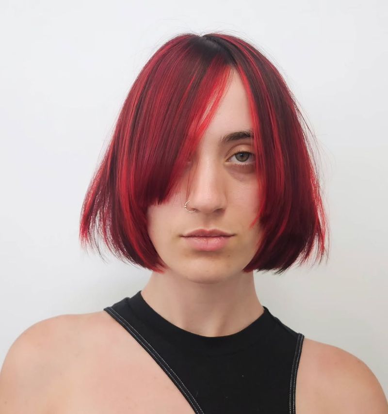11. Two-Tone Crimson Bob with Heavy Side Bangs