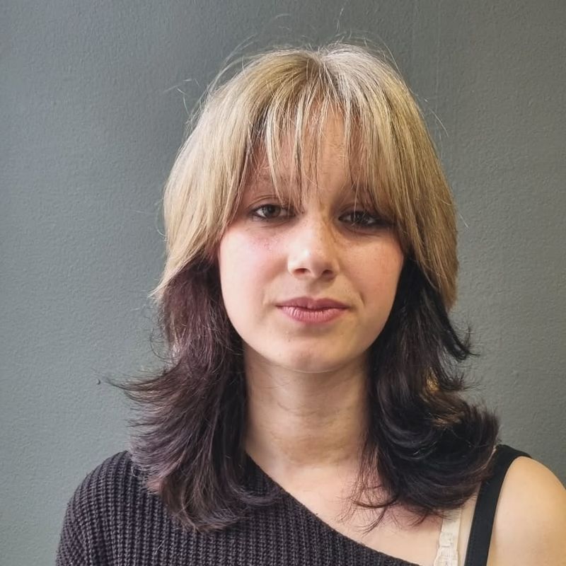 14. Two-Tone Layered Shag with Wispy Bangs