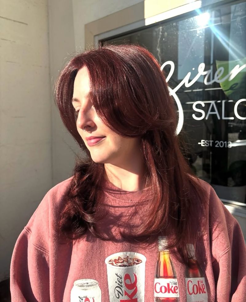 34. Velvet Curtain Bangs with Deep Berry Layers