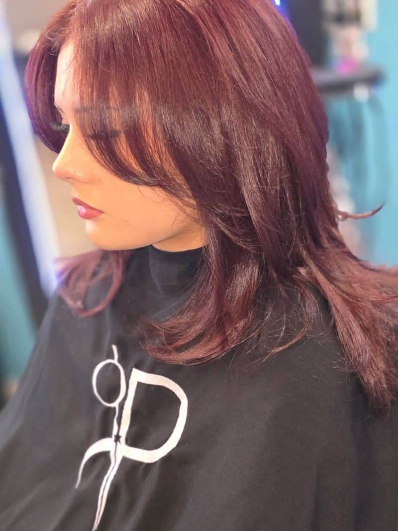 15. Velvet Plum Layers with Curtain Bangs